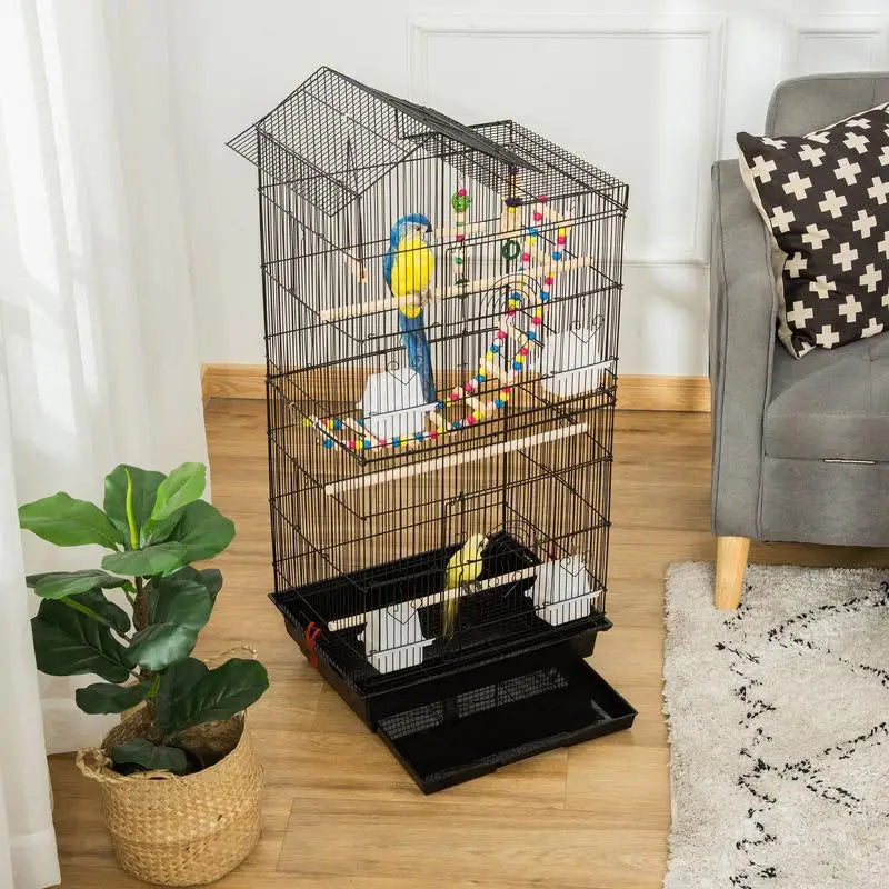 Cage à oiseaux avec accessoires et jouets, vue de profil
