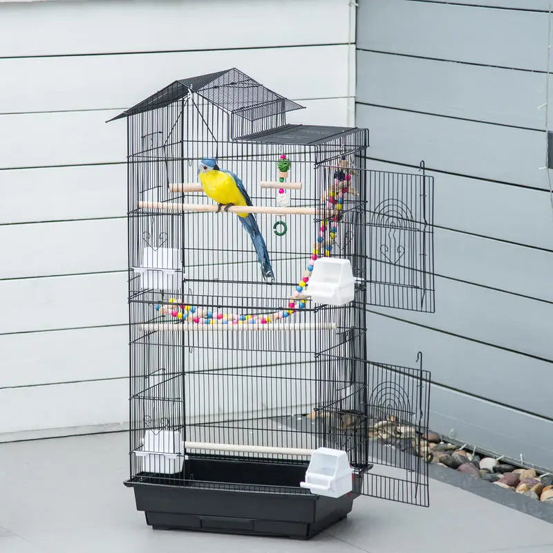 Cage à oiseaux avec accessoires et jouets, vue de face